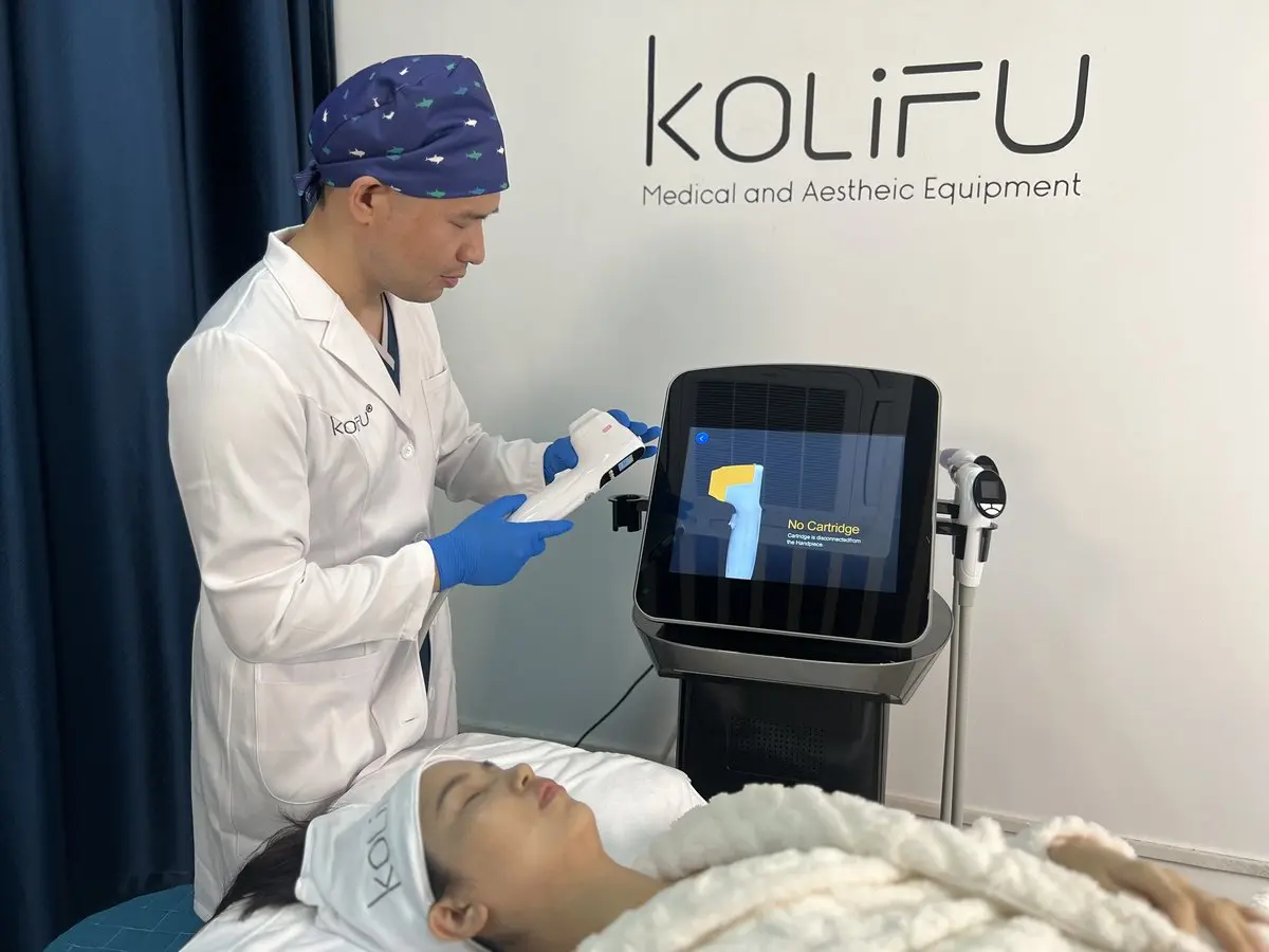 Range of KOLIFU treatment handpieces displayed for comparison at the factory